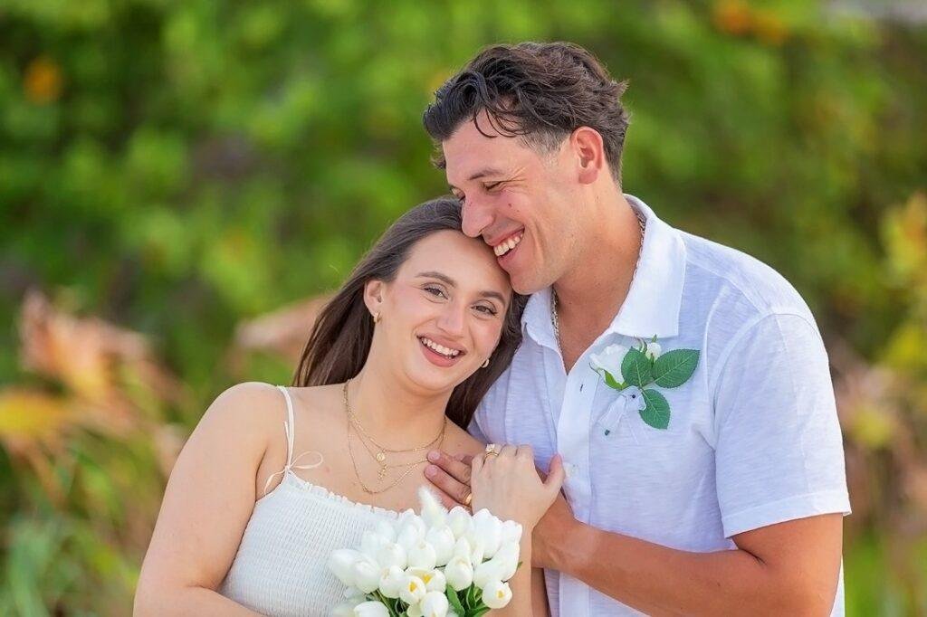 Couple smile at sunrise elopement on Captiva Island